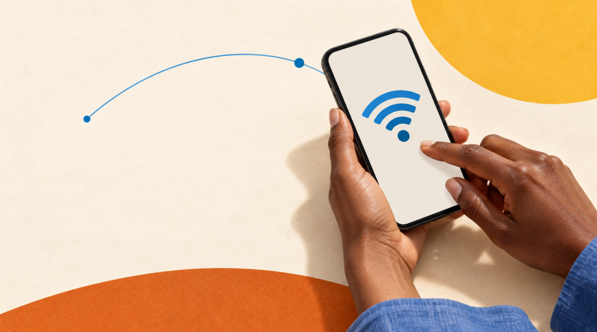 Mains utilisant un smartphone avec un symbole Wi-Fi, illustration des usages quotidiens d’Internet.