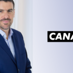 David Mignot, Directeur Général Afrique du Groupe CANAL+, à côté du logo CANAL+